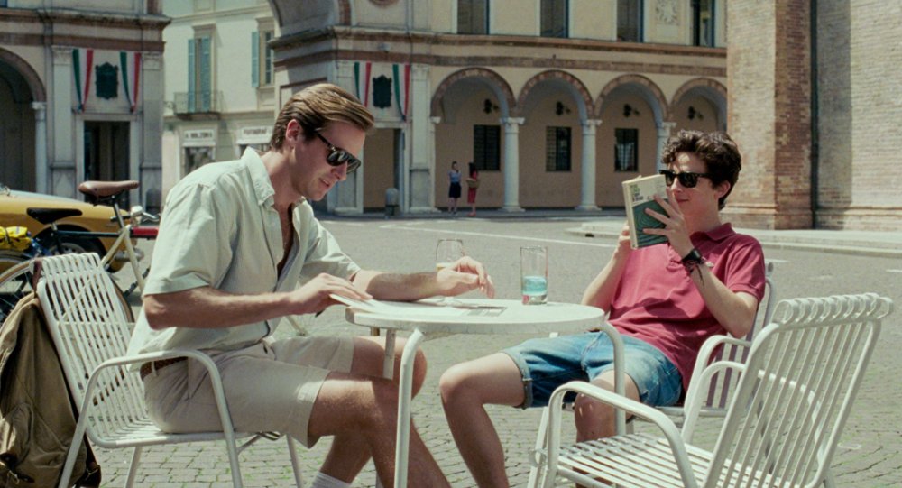 call-me-by-your-name-2017-003-armie-hammer-timothee-chalamet-cafe-table_0